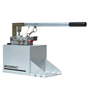 a hydraulic hand pump on top of a fluid reservoir