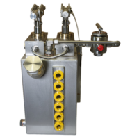 Rectangular reservoir with twin hand pumps on top and a round directional valve on the side. Coloured ATEX level indictor on tank.